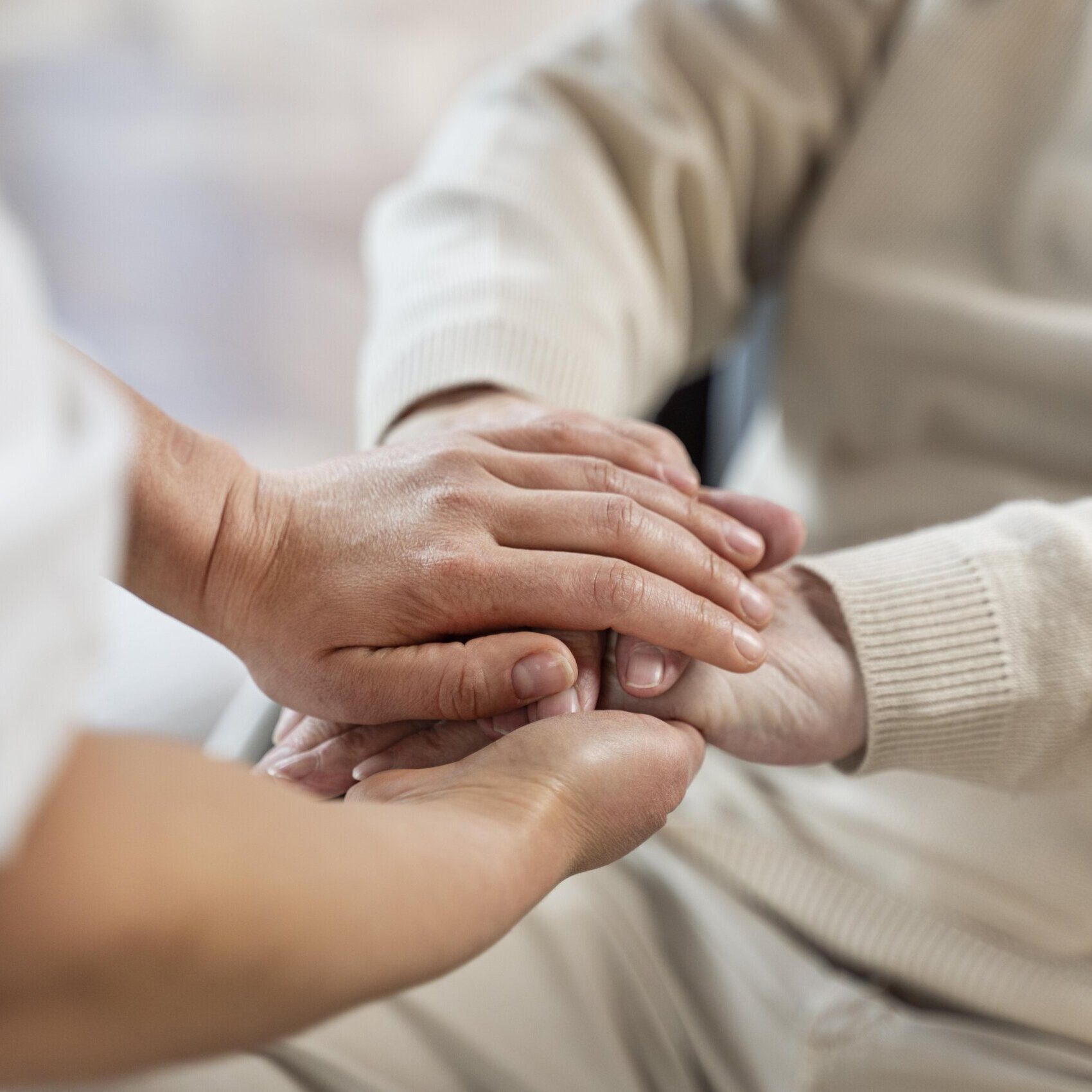 doctor-holding-hands-with-senior-patient-scaled-e1738689573286.jpg