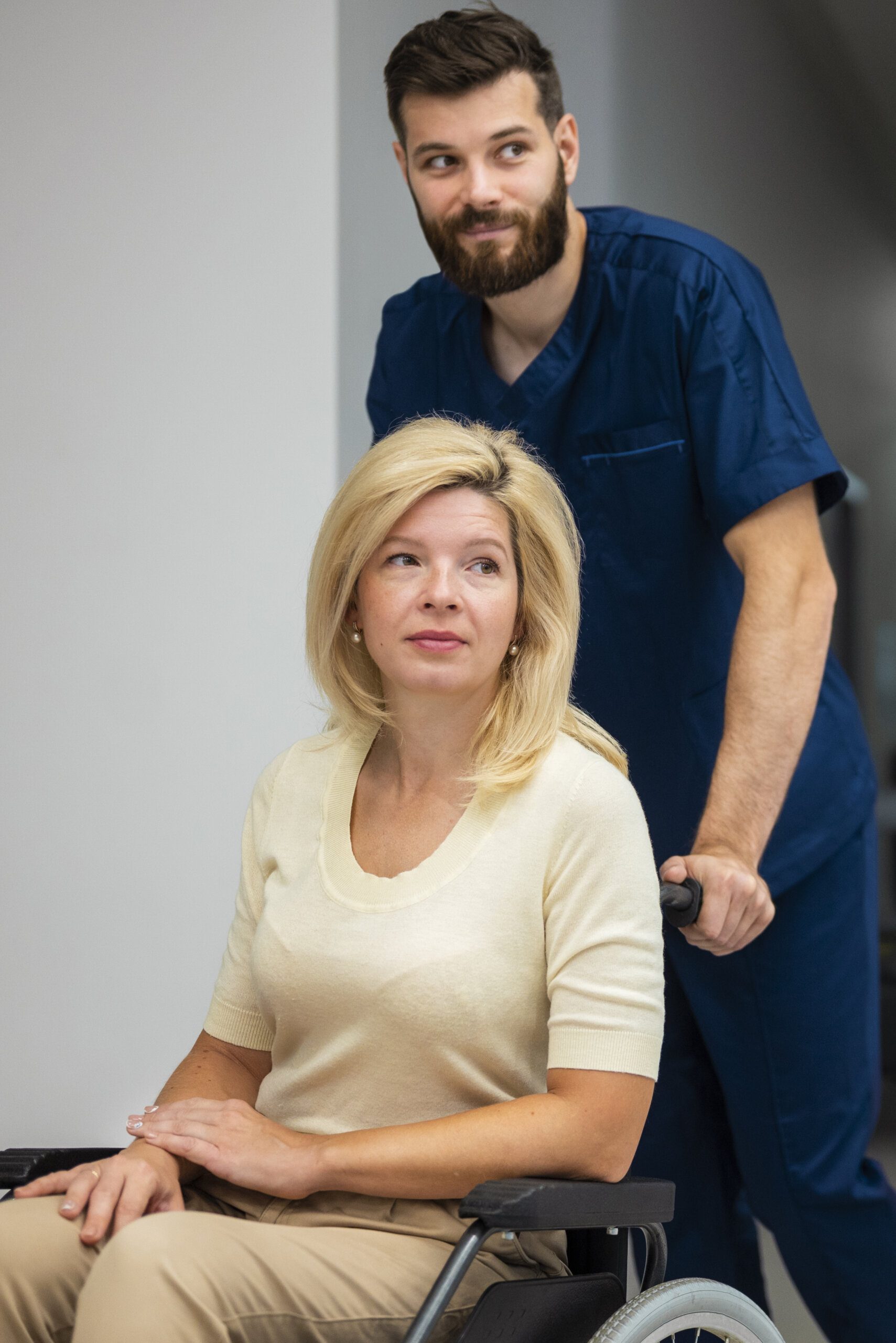 side-view-nurse-helping-patient-wheelchair-2-scaled-1.jpg